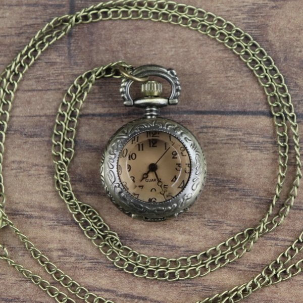 Small pocket watch with tinted glass lid